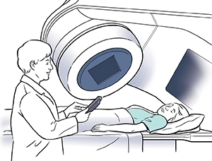 Woman on radiation table while technician prepares machine for radiation therapy.