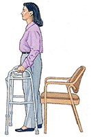 Woman using a walker to back up to chair.