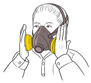 Woman testing fit of half-mask respirator.
