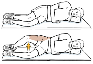 Man lying on side doing side-lying hip exercise.