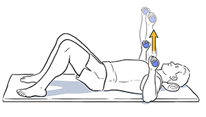 Man lying on back doing chest press exercise with hand weights.